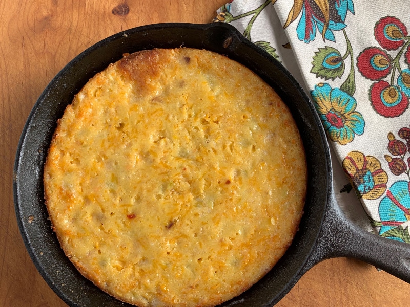 cast iron pan of corn pudding