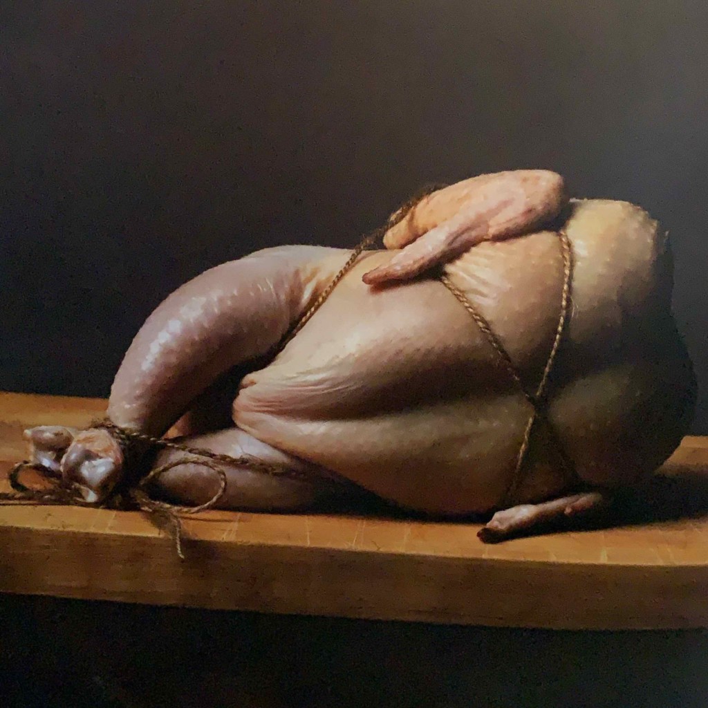 picture from 50 shades of chicken of a trussed chicken tied and laying on a cutting board