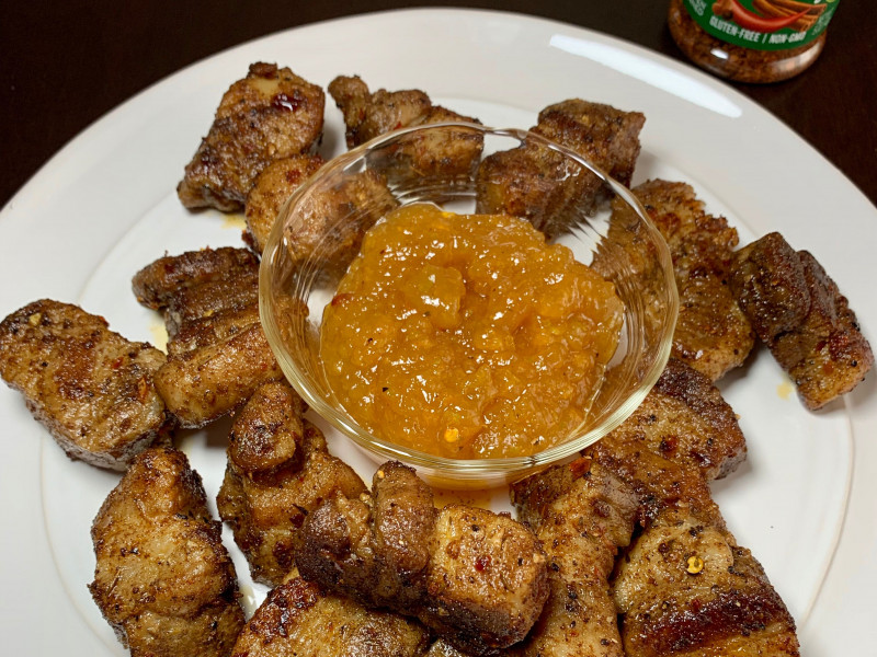platter of jamaican jerk pork belly with apricot dipping sauce