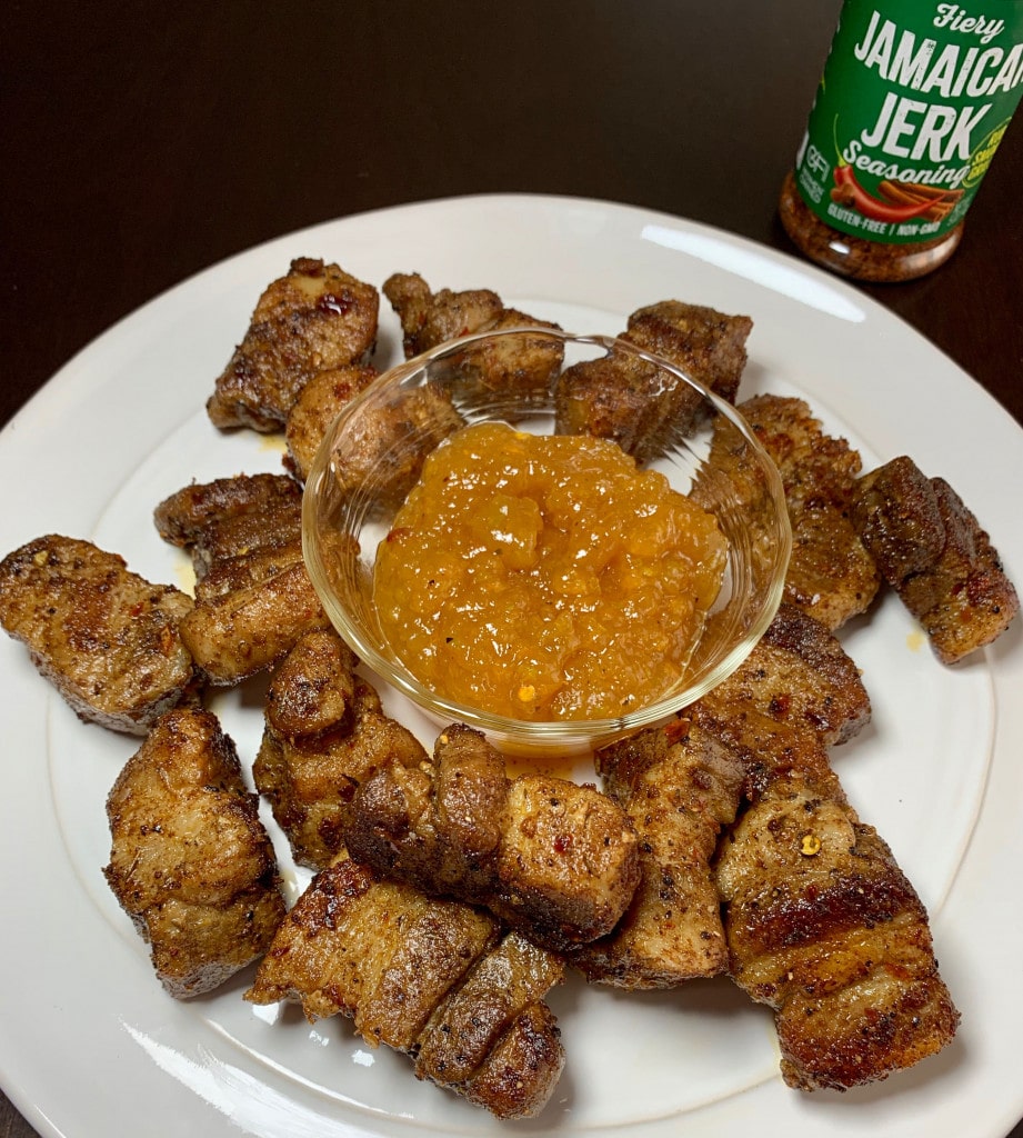platter of jamaican jerk pork belly with apricot dipping sauce