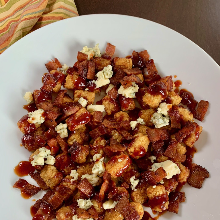 platter of BBQ bacon tots with blue cheese
