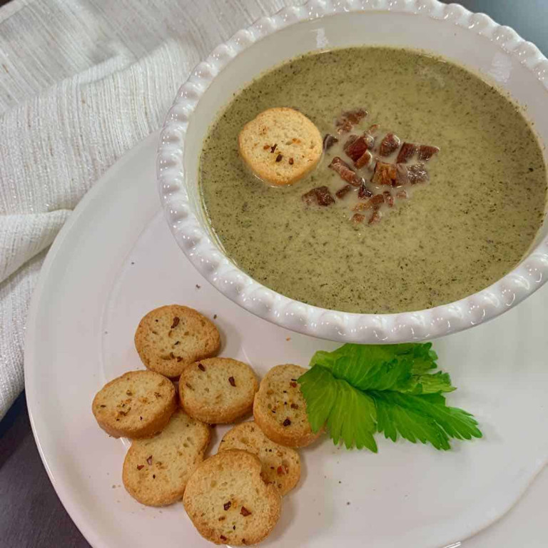 bowl of broccoli soup with croutons
