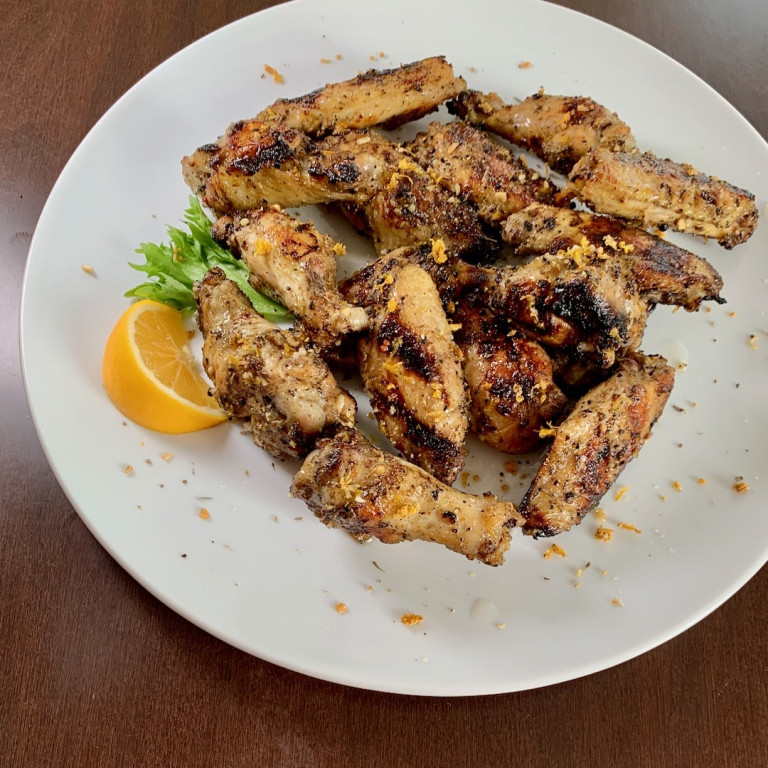 plate of wings with lemon