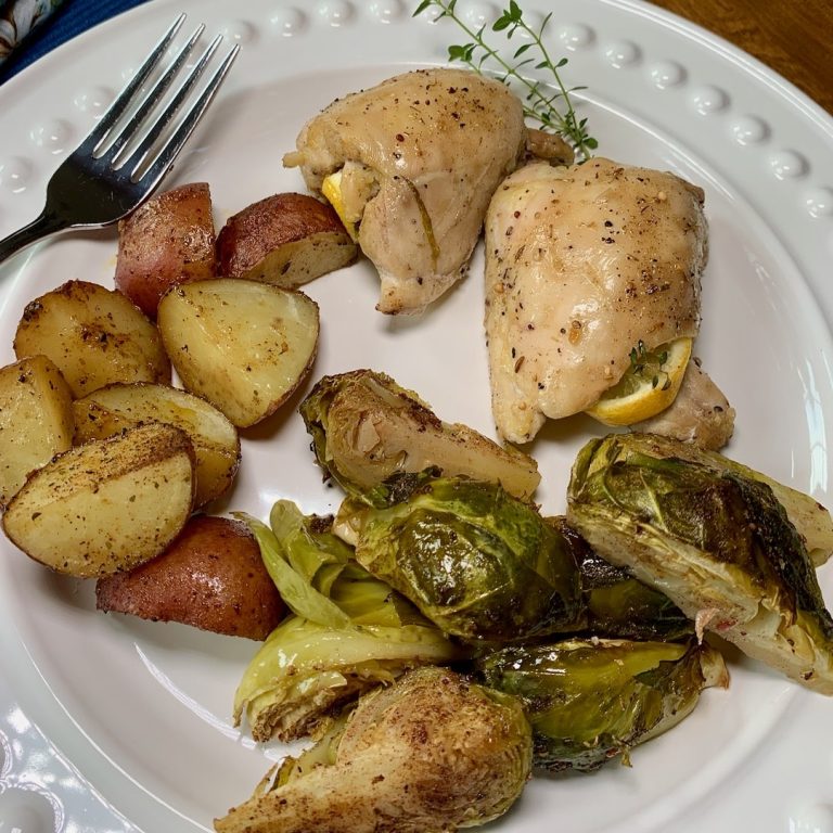 plate with a chicken sheet pan meal