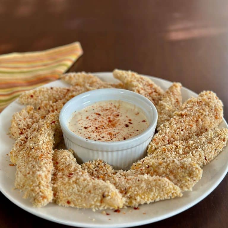 bowl of baked chicken tenders with dipping sauce